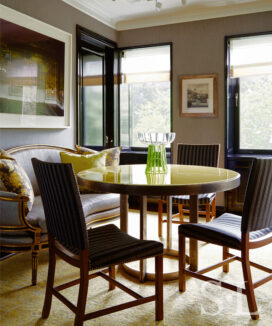 Fifth Avenue Pied-à-Terre dining room with a round dining table with high gloss yellow lacquered wood top and views of Central Park