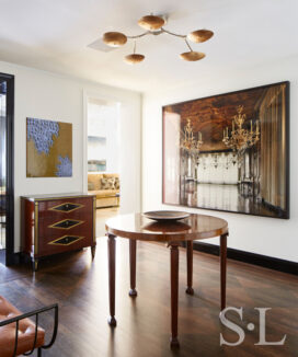 Fifth Avenue Pied-à-Terre foyer view towards dining room showing a photograph by Michael Eastman and Zodiac Table by Otto Schultz