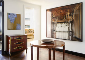 Fifth Avenue Pied-à-Terre foyer view towards dining room showing a photograph by Michael Eastman and Zodiac Table by Otto Schultz