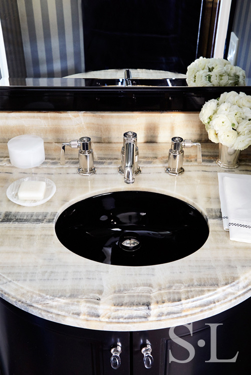Fifth Avenue Pied-à-Terre powder room detail with black cabinets and greige onyx countertop