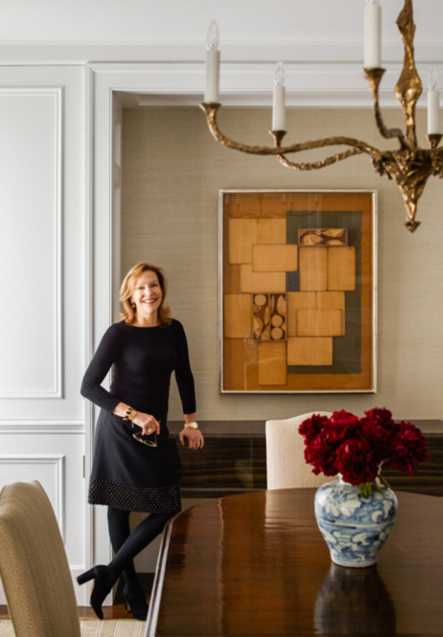 Suzanne Lovell in dining room of a residence she designed in Chicago with artwork by Louise Nevelson