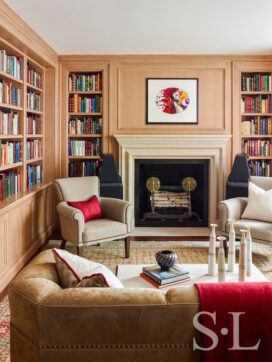 Chicago penthouse library with fireplace and natural cerused white oak paneling and shelves