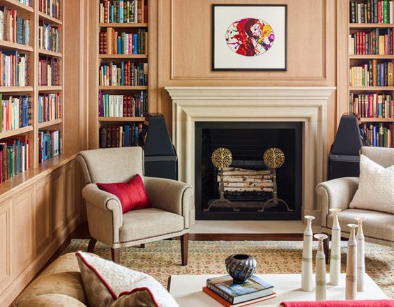 Chicago penthouse library with fireplace and natural cerused white oak paneling and shelves