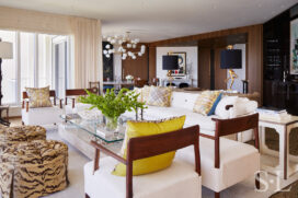 Light and bright great room interior designed with decorative pillows by Hermès and sofa by Robert Crowder