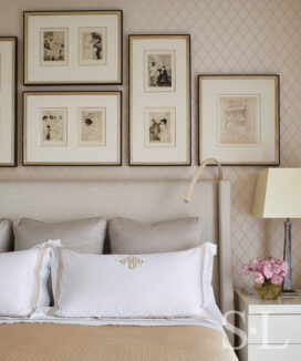 Master bedroom detail with gallery wall above headboard