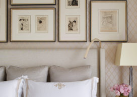 Master bedroom detail with gallery wall above headboard
