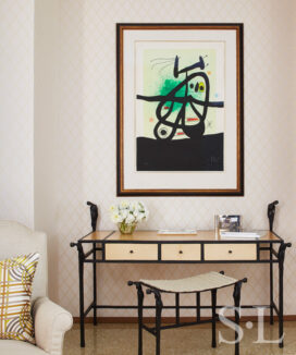 Sitting room detail showing artwork by Joan Miró above a desk and seat by Ingrid Donat