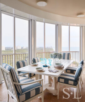 Terrace with furniture by McKinnon and Harris upholstered in striped outdoor fabric by Perennials