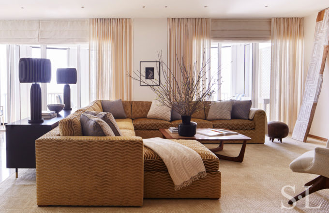Family room with custom sectional sofa and Vladimir Kagan coffee table