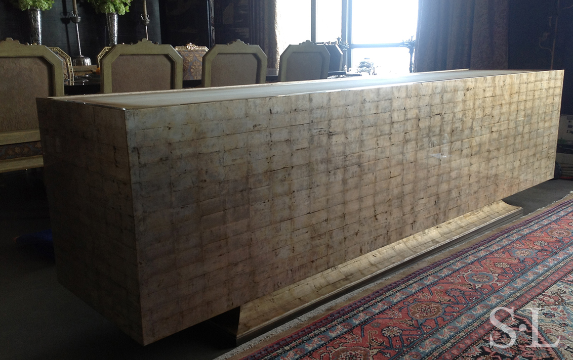 Detail of back of award winning custom credenza designed by Suzanne Lovell Inc. showing silver leaf over Victorian yellow clay