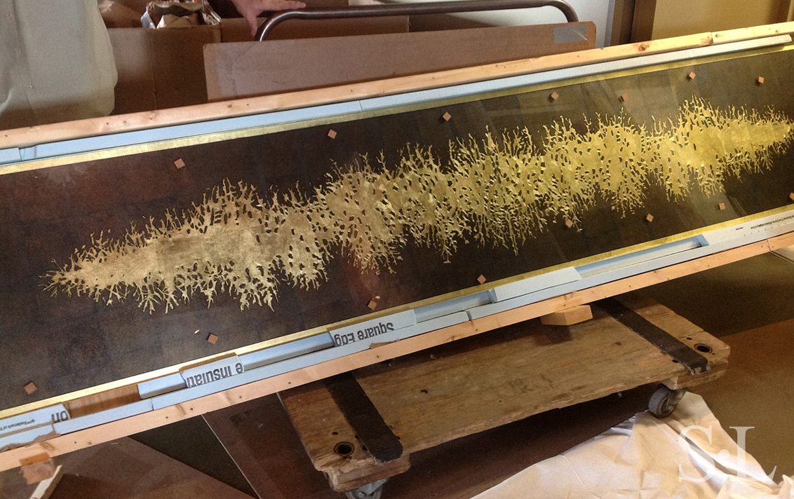 Detail of top of award winning custom credenza designed by Suzanne Lovell Inc. showing verre églomisé