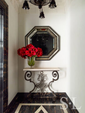 Entry vestibule featuring a console by Gilbert Poillerat