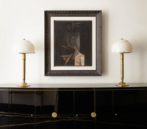 Entry gallery detail featuring artwork by Wilfredo Lam and a black lacquer De Coene Frères sideboard