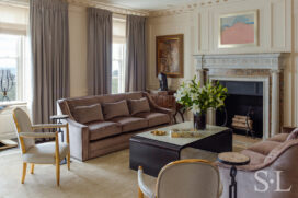 Living room luxury interior renovation featuring the fully restored original fireplace