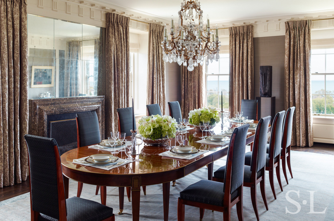 Dining room luxury interior renovation featuring silk wall upholstery by Jim Thompson and Fortuny drapery