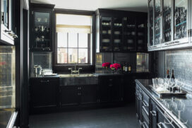 Butler’s pantry featuring a German Silver sink and black painted cabinetry