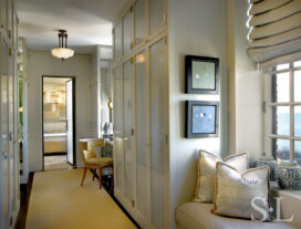 Deco-era duplex apartment dressing closet with window seat and desk off the primary bedroom