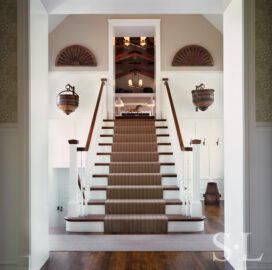 Restored landmark residence on former military base staircase leading to great room with antique Chinese well buckets