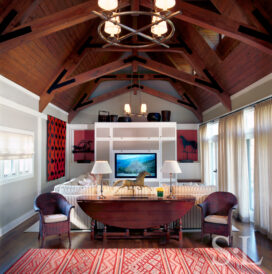 Restored landmark residence on former military base great room with chain-stitched runner and ‘prancing horse’ weather vane