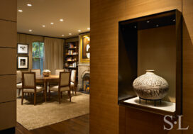 Lincoln Park Chicago landmark residence view into dining room with fireplace and display case featuring ancestral Puebloan water vessel