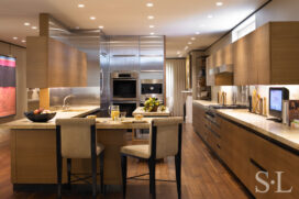 Lincoln Park Chicago landmark residence kitchen with horizontal banded American Elm cabinets and stainless steel