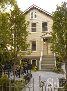 Lincoln Park Chicago landmark residence exterior view of front of house and front patio with seating area