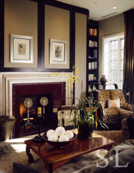 Chicago townhome living room fireplace with drawings by Whistler and Rubens above