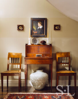 Chicago townhome entry with a Federal tambour desk and portrait by John Blunt