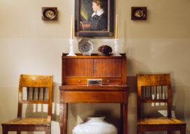 Chicago townhome entry with a Federal tambour desk and portrait by John Blunt