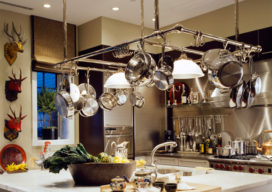 Chicago townhome kitchen with large pot rack over center island