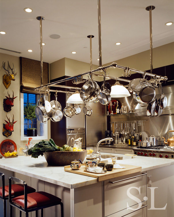 Chicago townhome kitchen with large pot rack over center island