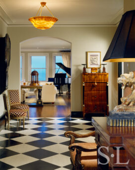 1920s era Lake Shore Drive penthouse entrance hall with black and white checkerboard floor