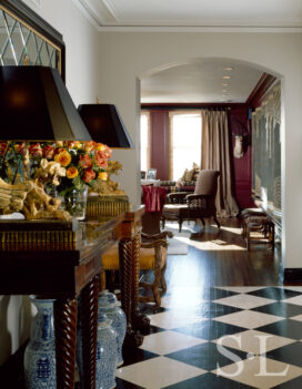 1920s era Lake Shore Drive penthouse entrance hall with black and white checkerboard floor