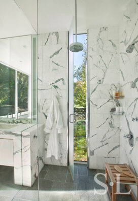 Lake House bathroom shower in marble that opens to outdoors