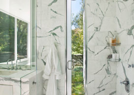 Lake House bathroom shower in marble that opens to outdoors