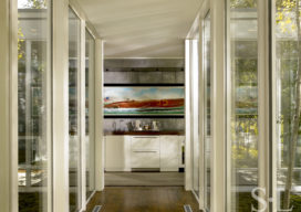 Hallway view towards wet bar with zinc covered walls