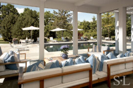 Screened in porch off the kitchen, facing the swimming pool, that can be completely opened up to the outdoors