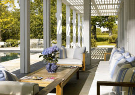 Screened in porch off the kitchen, facing the swimming pool, that can be completely opened up to the outdoors