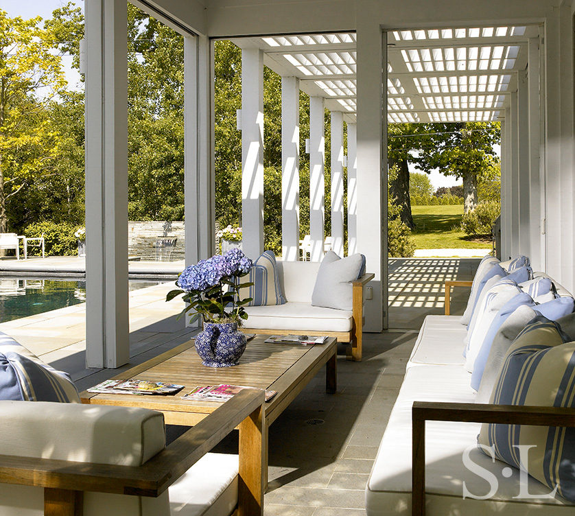 Screened in porch off the kitchen, facing the swimming pool, that can be completely opened up to the outdoors