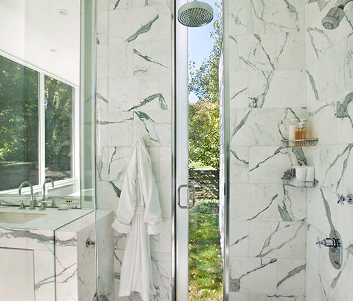 Master bath shower in marble that opens to outdoors