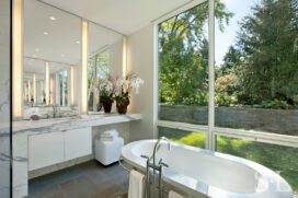 Master bath view towards vanity and view out large windows