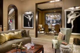 Living room view into dining room with artwork by Joseph Piccillo and Candida Hofer