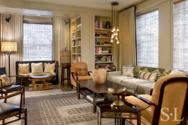 Chicago high-rise apartment living room with many patterns and colors and a graphic rug