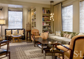 Chicago high-rise apartment living room with many patterns and colors and a graphic rug