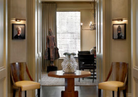 Chicago high-rise apartment rotunda with hand-blown glass pendant lamp and ceramic vessel by Kate Malone