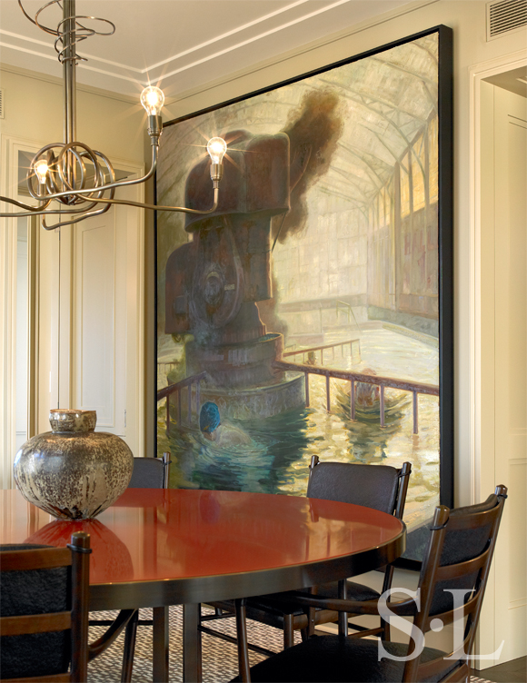 Chicago high-rise apartment dining room with brass chandelier and lacquer and bronze table