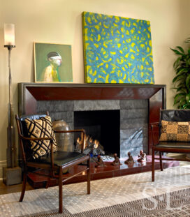 Chicago high-rise apartment living room detail showing fireplace and artwork by Joby Baker and Bill Zima