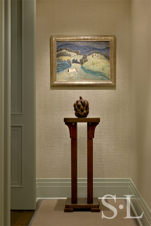Chicago high-rise apartment hallway showing a Milton Avery painting above a vessel by Axel Salto