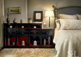 Chicago high-rise apartment bedroom with overscale nightstand with ceramics collection