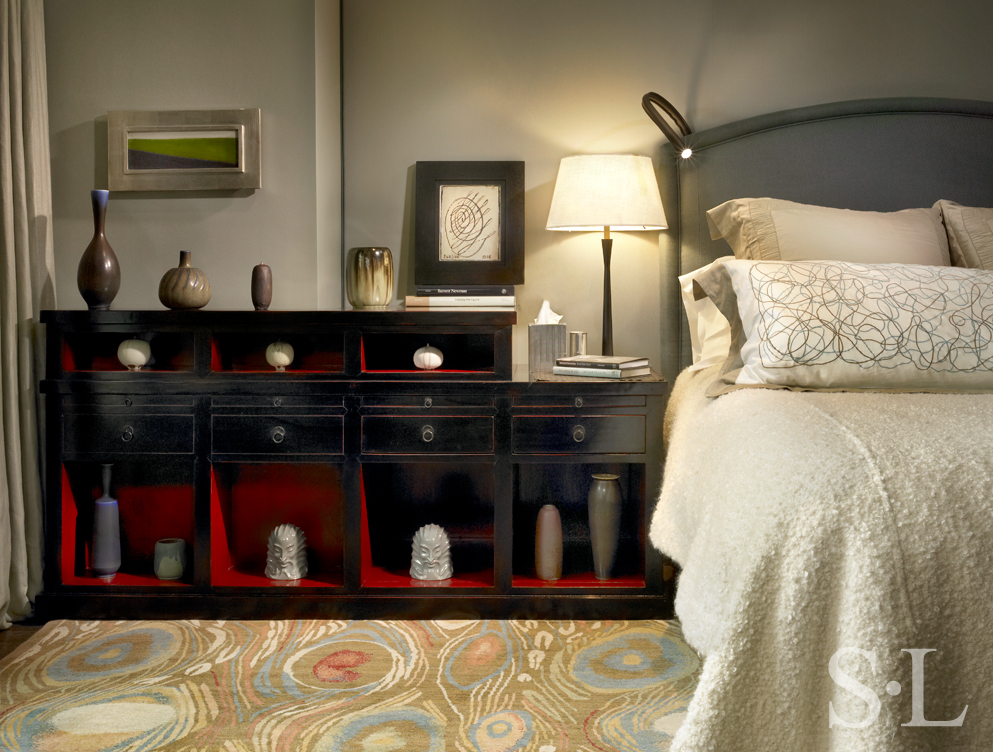 Chicago high-rise apartment bedroom with overscale nightstand with ceramics collection